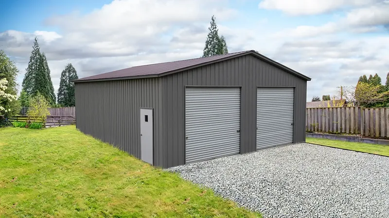 Photo of the Foundry, a 32 by 40 foot steel two-bay shop with quaker gray walls and a barn red roof